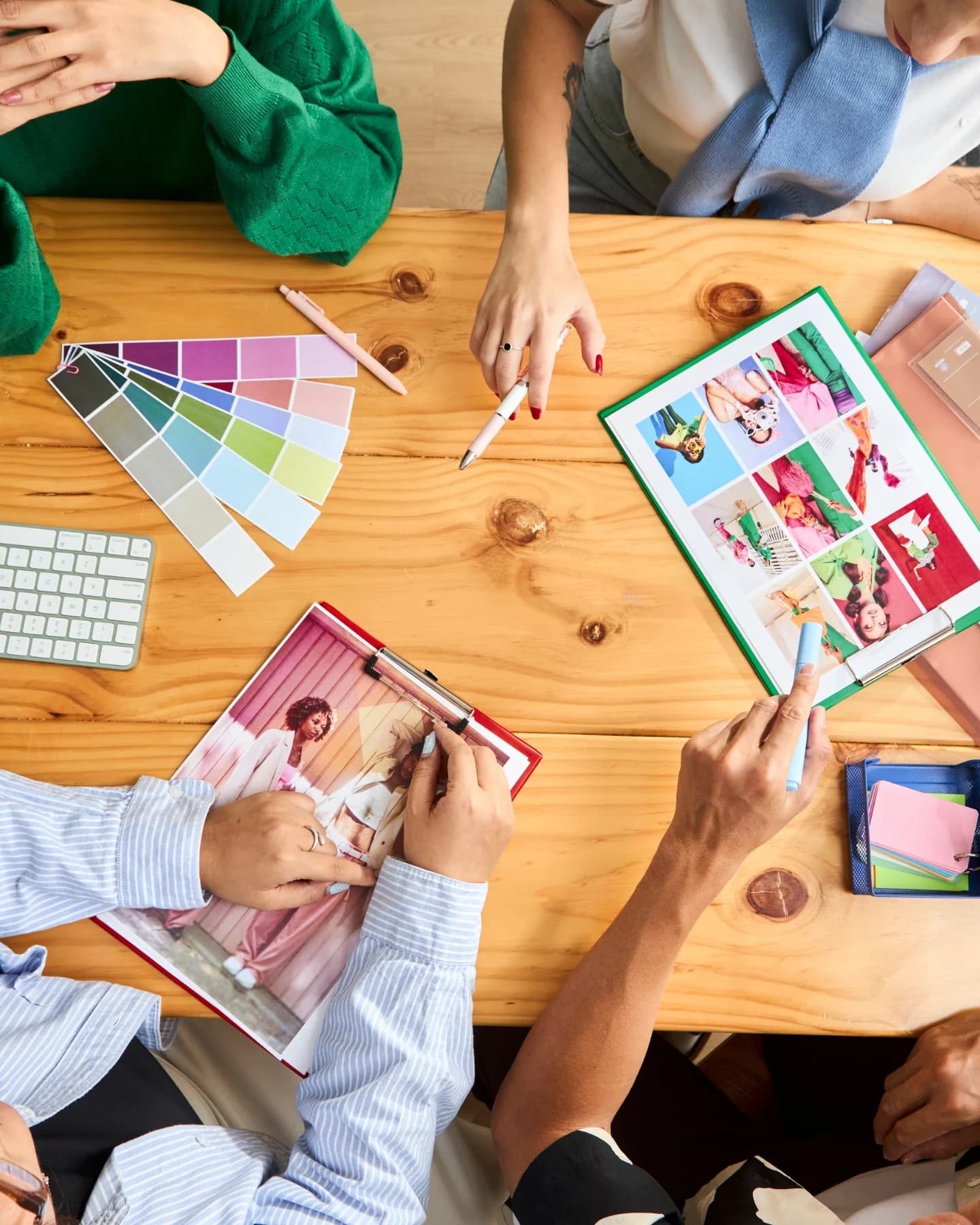 Team reviewing colour swatches and layouts on a table