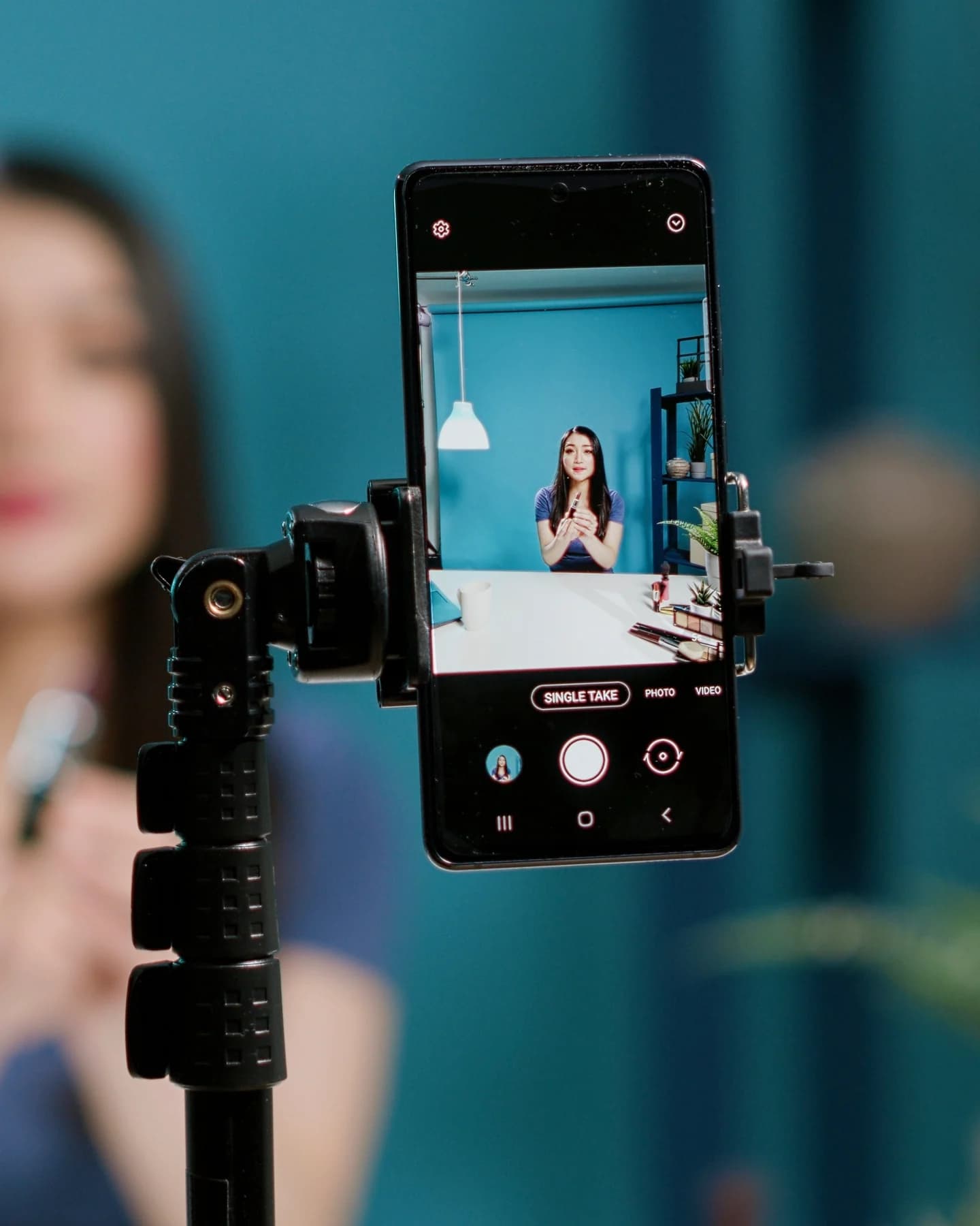 Phone on a tripod recording a creator