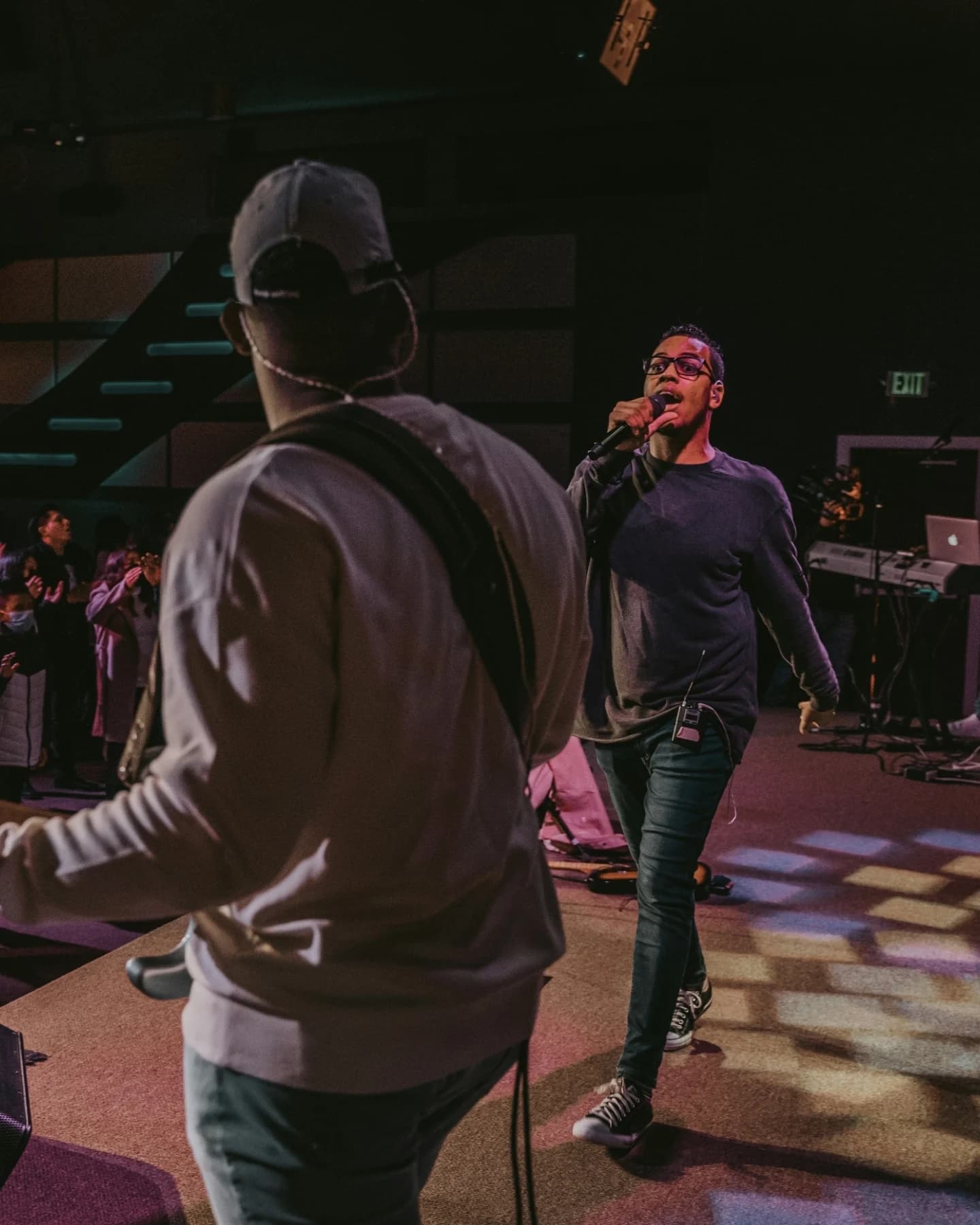 Band performing on stage to a live audience