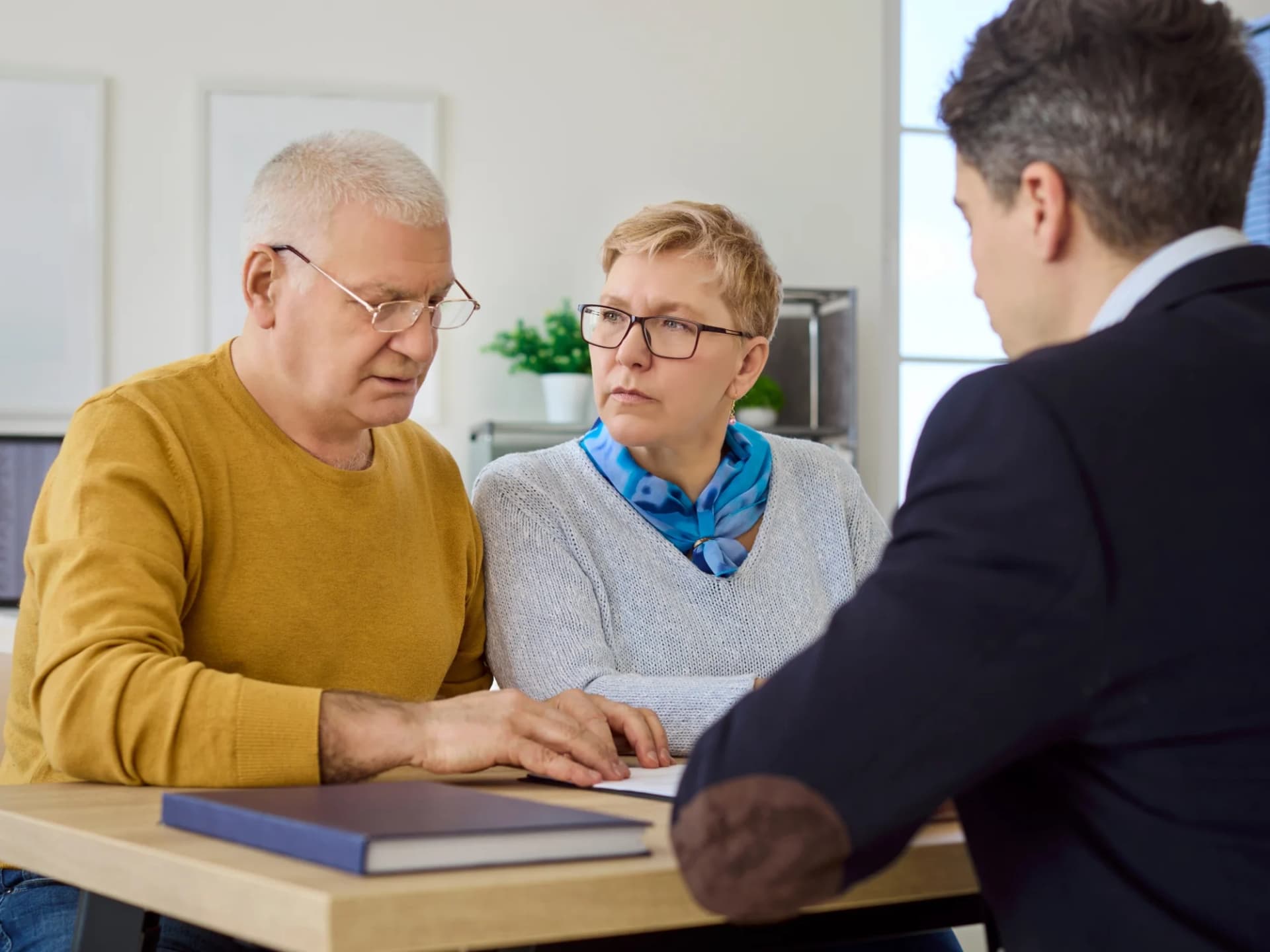 Tax accountant reviewing pensions with a retired couple