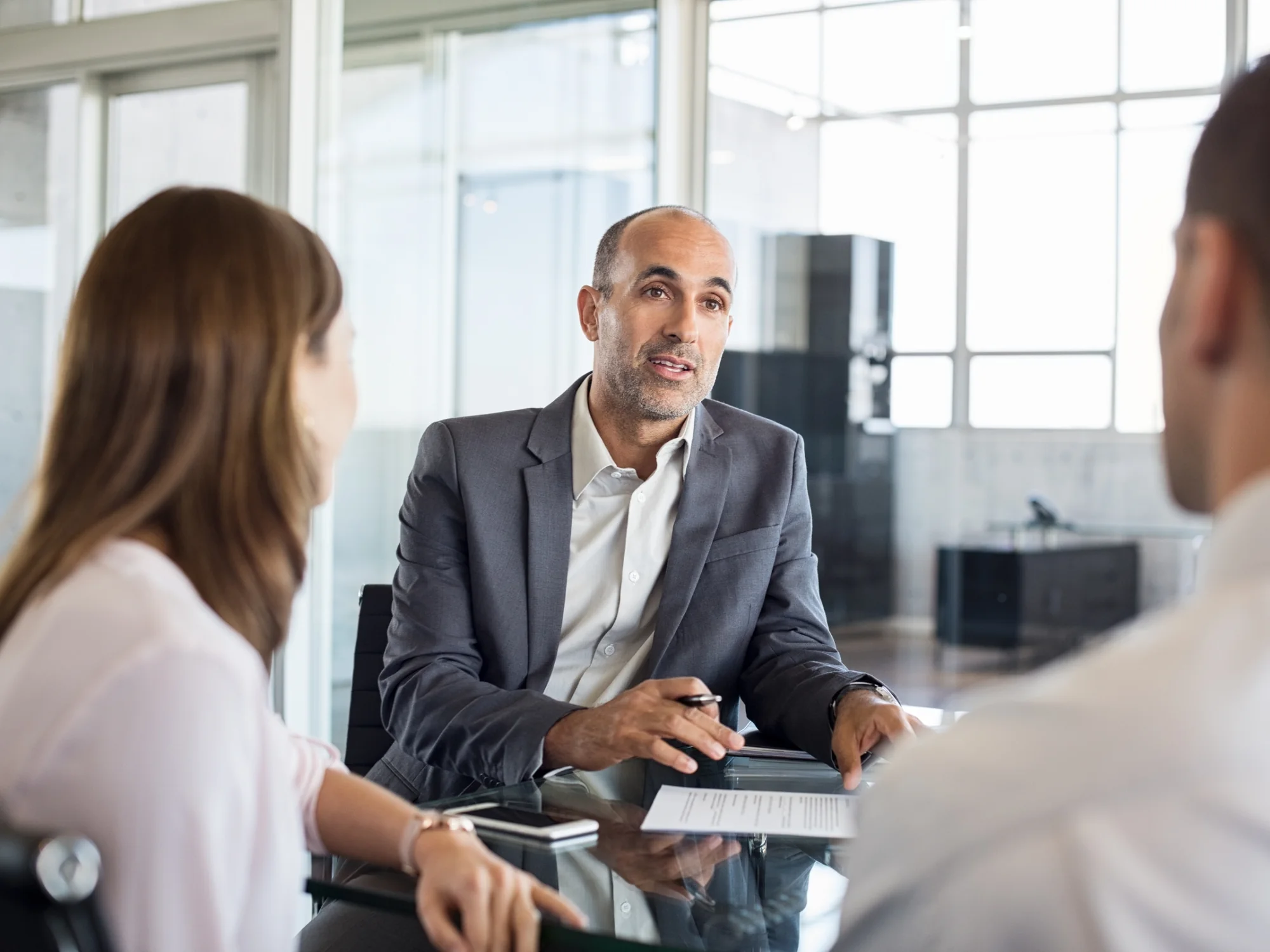 Tax accountant talking a client through a fund disposal