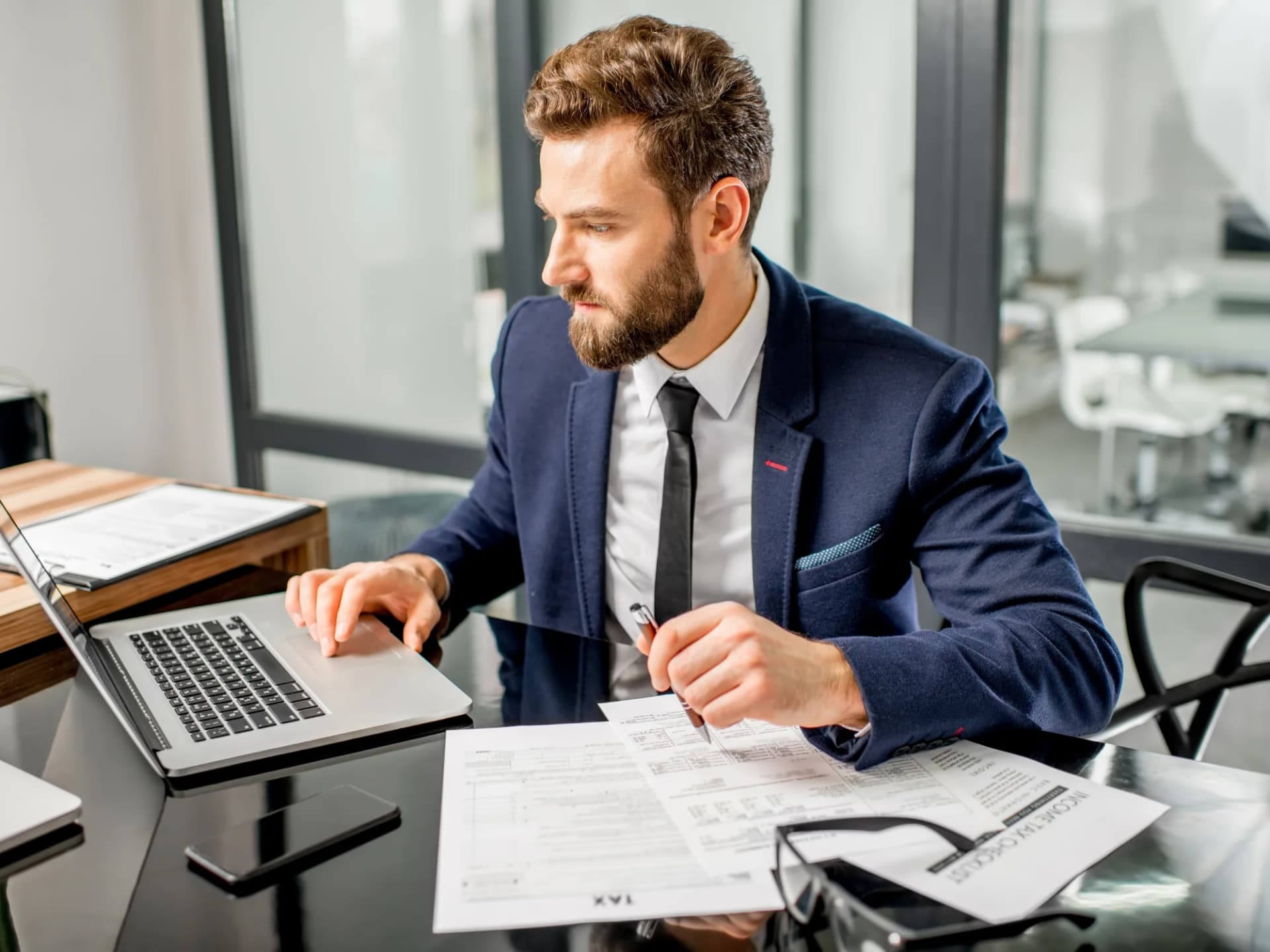 Tax accountant working at a desk on a client file