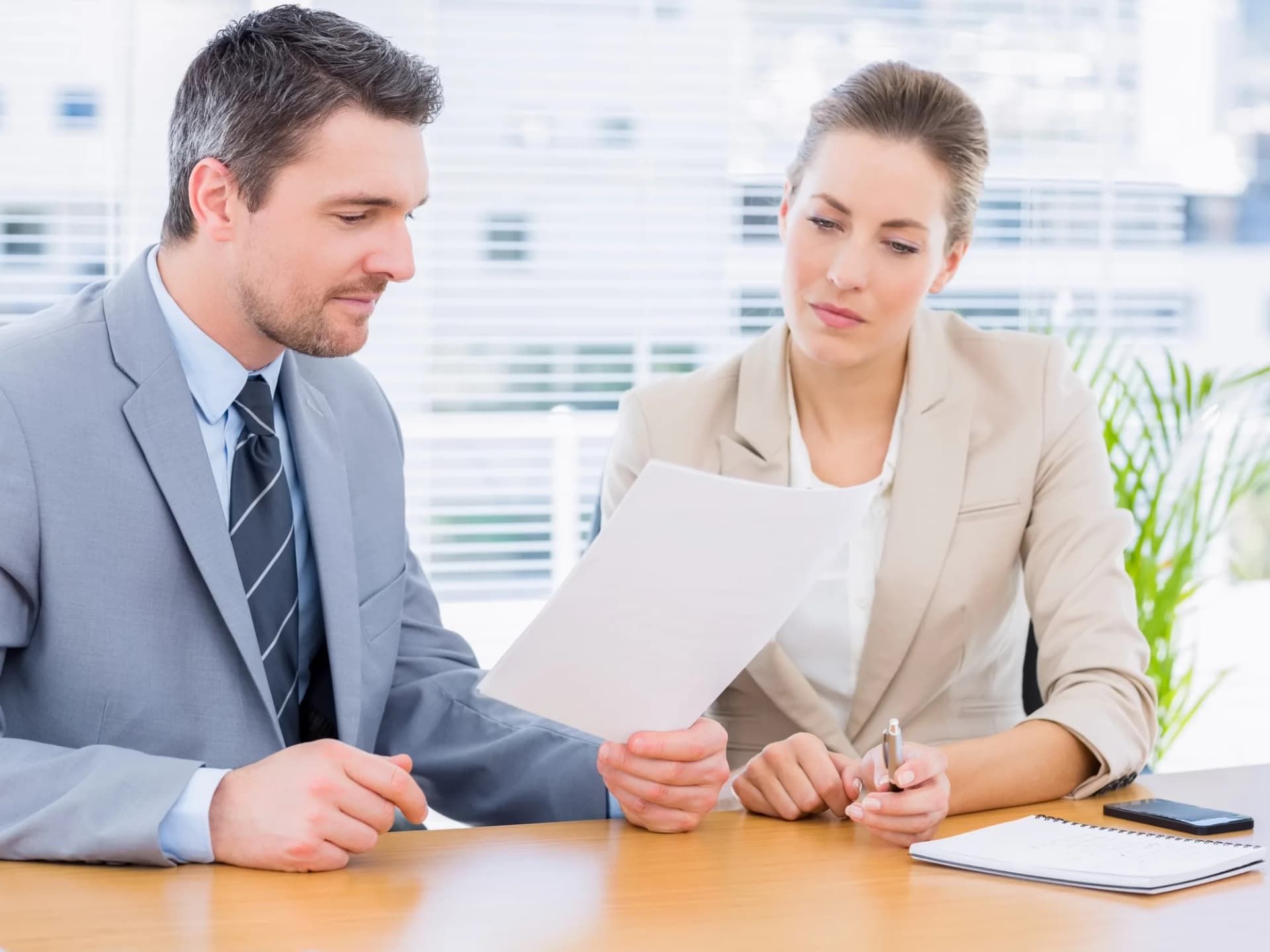 Two tax accountants reviewing a return together